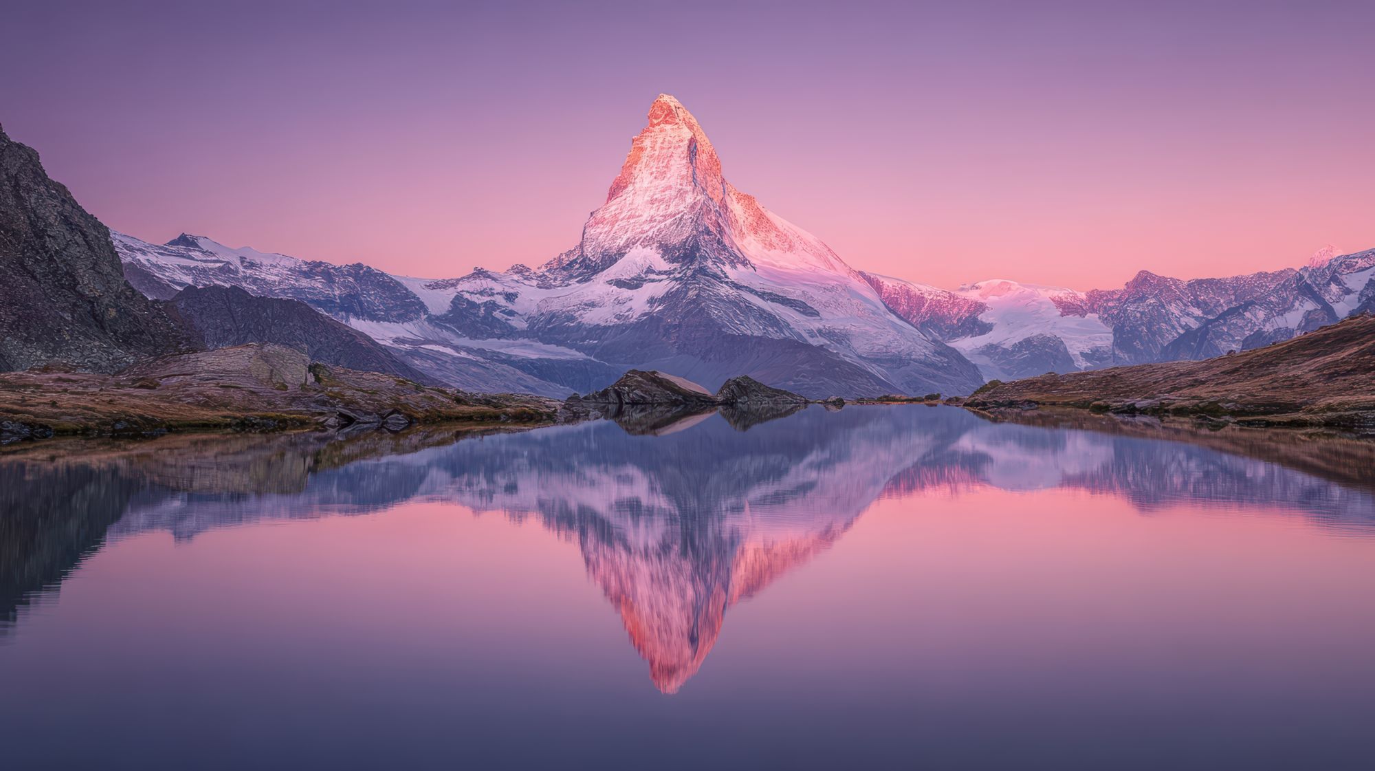 The Matterhorn at sunrise, reflected in an alpine lake